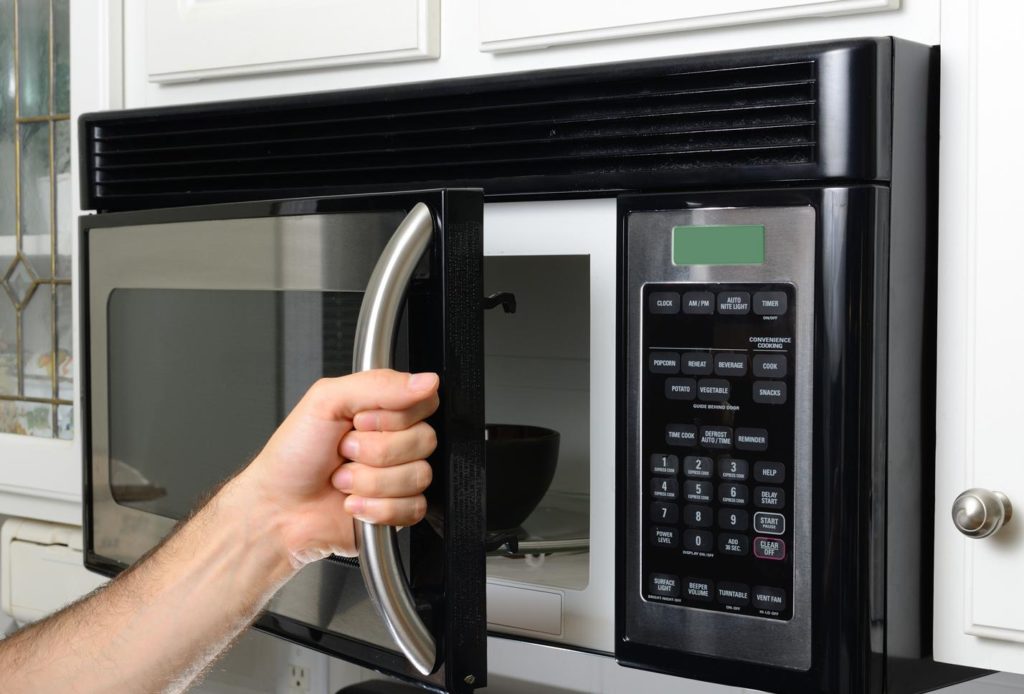 Connect the microwave under a wall cabinet or shelf