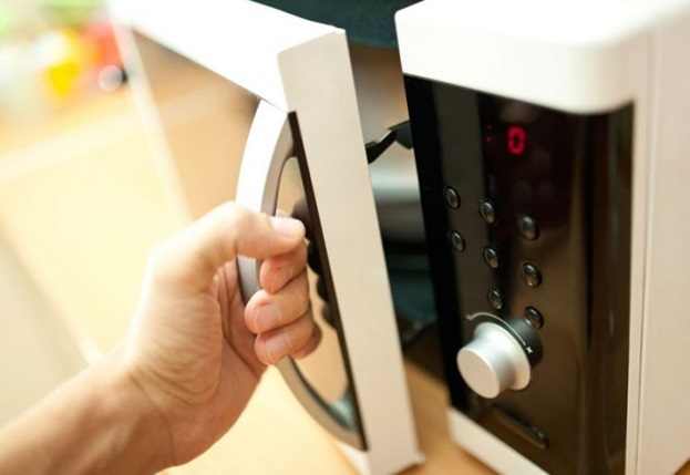 Connect the microwave under a wall cabinet or shelf