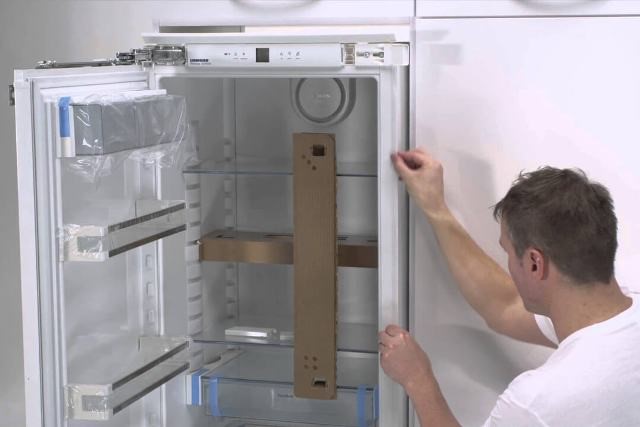 What is the difference between a built-in refrigerator and a regular refrigerator?