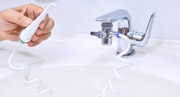 How to use an oral irrigator on a tap?